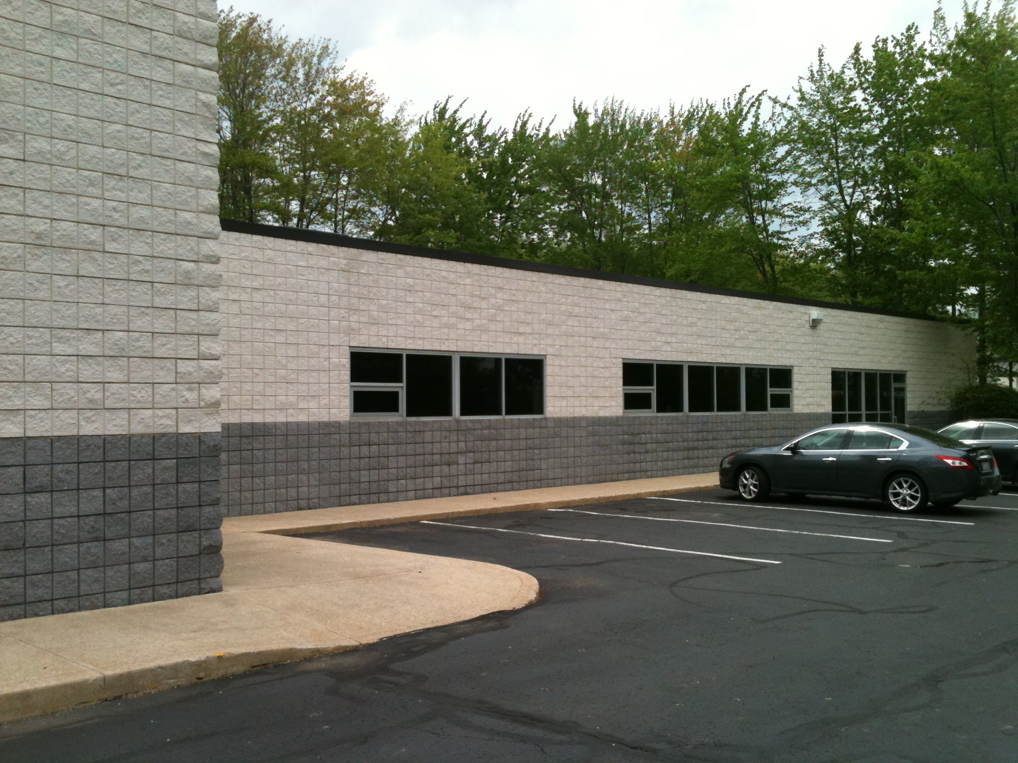 Side Of Commercial Building After Industrial Cleaning And Commercial Painting